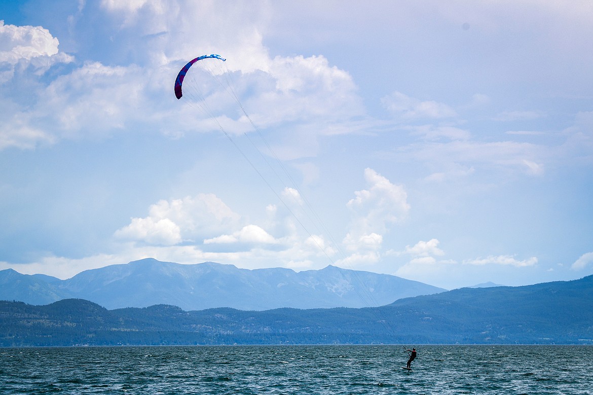 A kite foiler sails across Flathead Lake in Lakeside on Wednesday, June 28. (Casey Kreider/Daily Inter Lake)