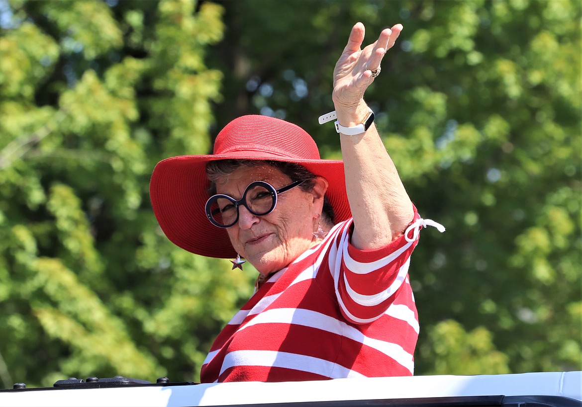 Marlo Faulkner, grand marshal of the Coeur d'Alene Regional Chamber's Fourth of July parade, waves to the crowd on Tuesday.