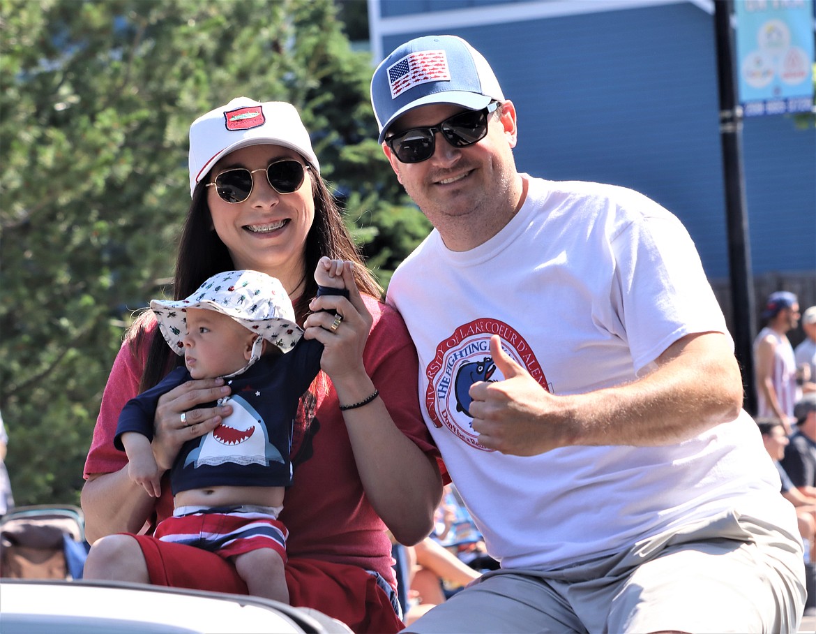 Lindsay Patterson, chamber Volunteer of the Year, is joined by Peter Howard and baby Walker Howard in the Fourth of July parade on Tuesday in CDA.