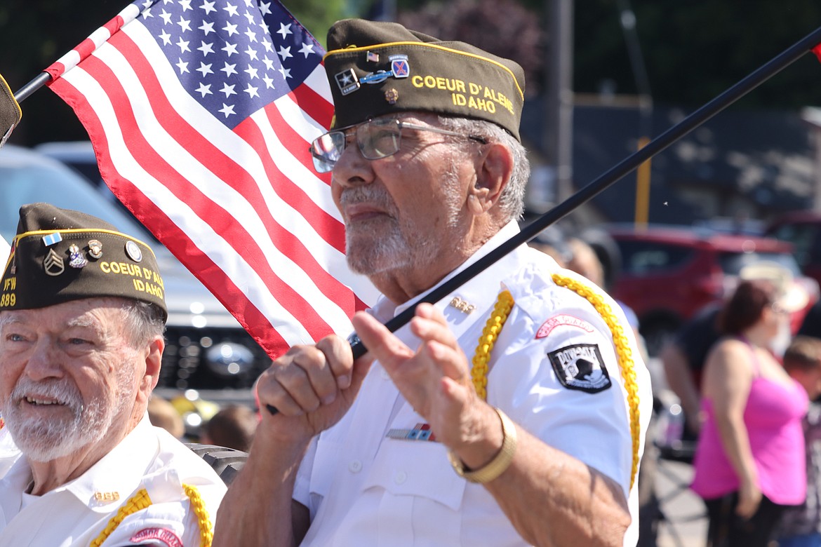 Veterans Bob Banta, left, and Charles Riffel look on during the Fourth of July parade in Coeur d'Alene on Tuesday.