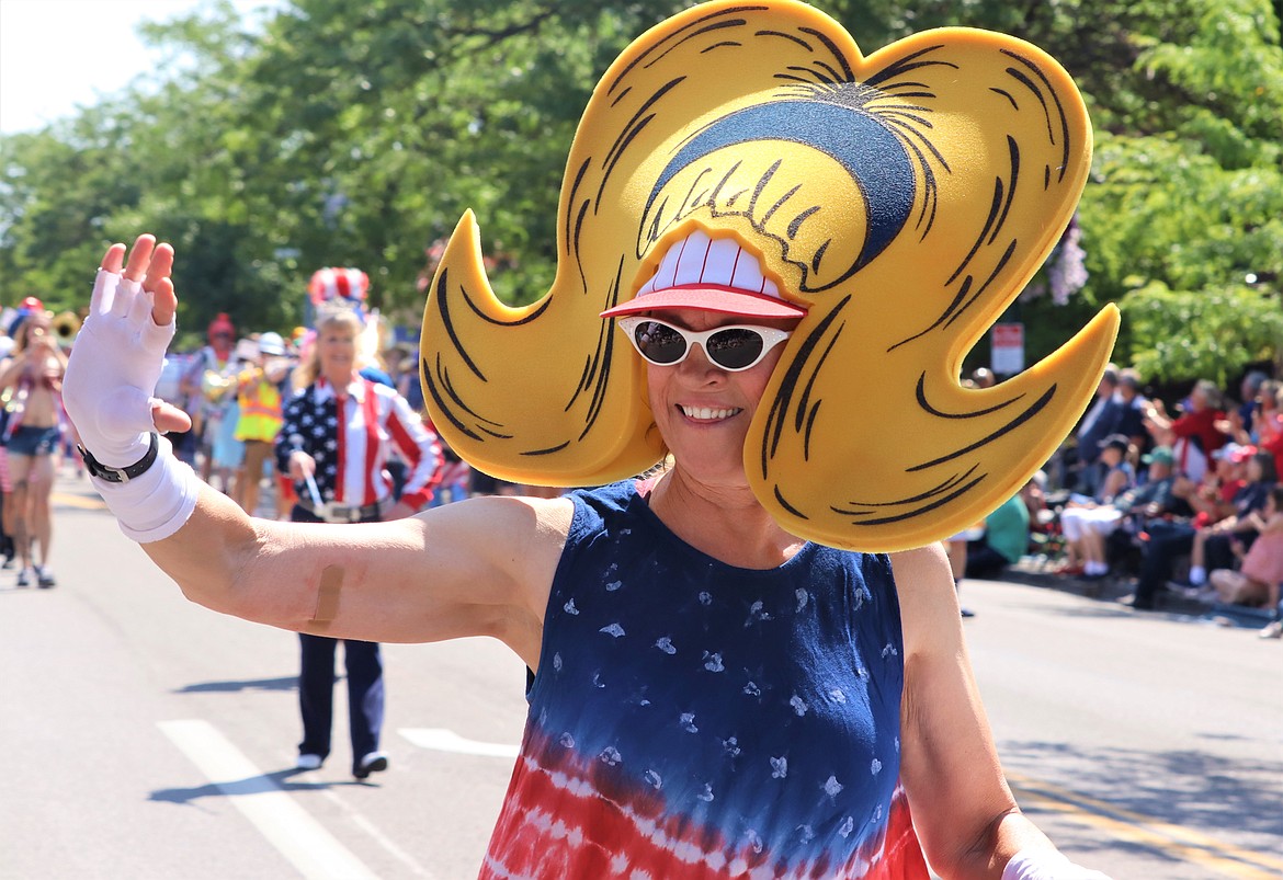 Trena Burt with the Perfection Nots smiles during the parade on Tuesday.