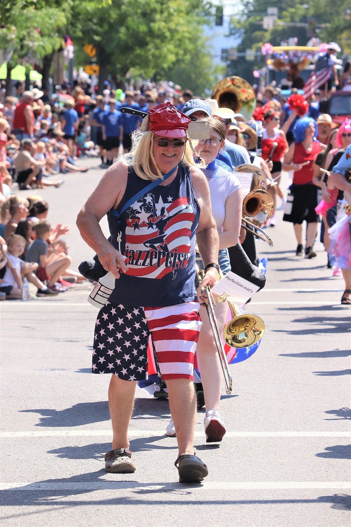 Denny Burt with the Perfection Nots leads a row of musicians in the Fourth of July parade Tuesday.