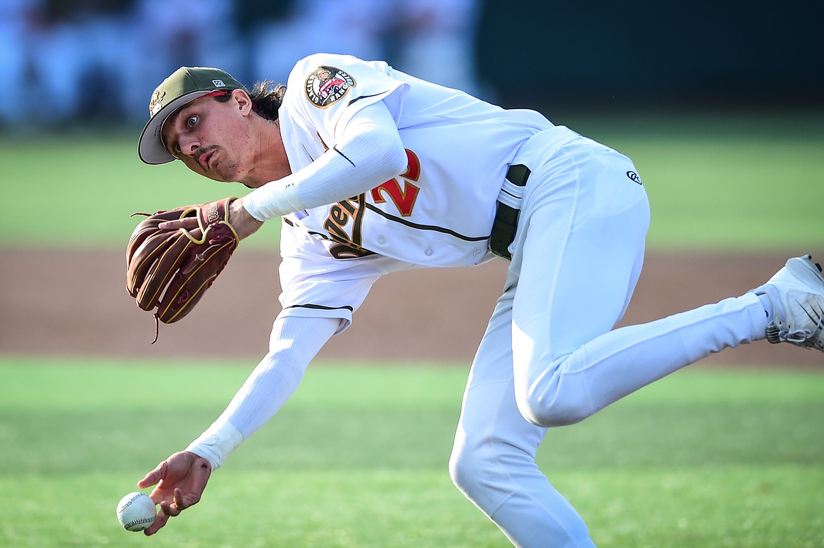 Glacier second baseman Mason Dinesen (23) charges a slow-roller and throws to first to end the inning in the top of the second against the Ogden Raptors at Glacier Bank Park on Wednesday, July 5. (Casey Kreider/Daily Inter Lake)