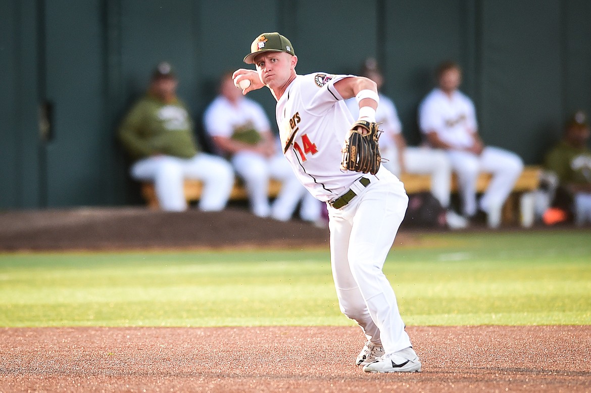 Glacier third baseman Jackson Raper (14) fires to first base for an out in the fifth inning against the Ogden Raptors at Glacier Bank Park on Wednesday, July 5. (Casey Kreider/Daily Inter Lake)