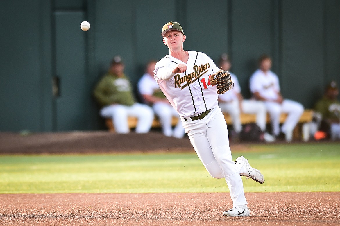 Glacier third baseman Jackson Raper (14) fires to first base for an out in the fifth inning against the Ogden Raptors at Glacier Bank Park on Wednesday, July 5. (Casey Kreider/Daily Inter Lake)