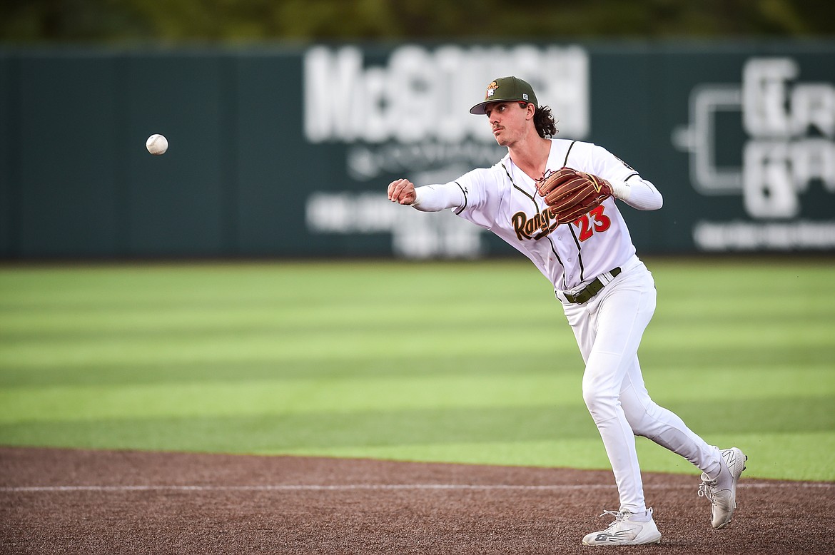 Glacier second baseman Mason Dinesen (23) throws to first for an out in the third inning against the Ogden Raptors at Glacier Bank Park on Wednesday, July 5. (Casey Kreider/Daily Inter Lake)