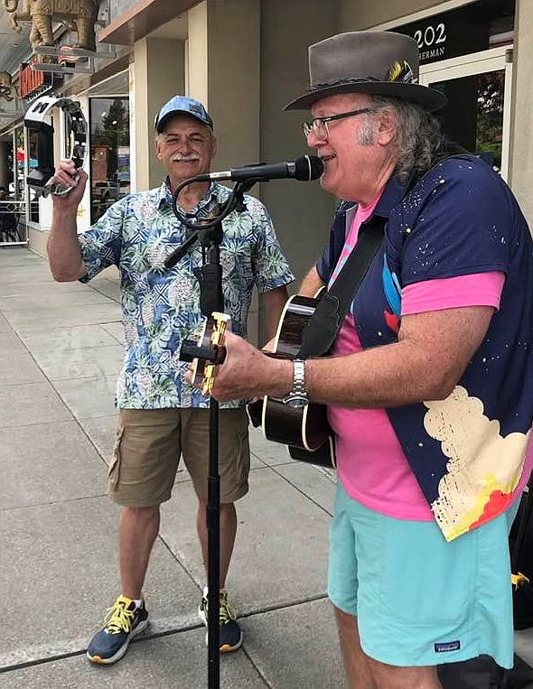 Busker Doug Clark accompanied by “Mr. Tambourine Man” Dave Oliveria.