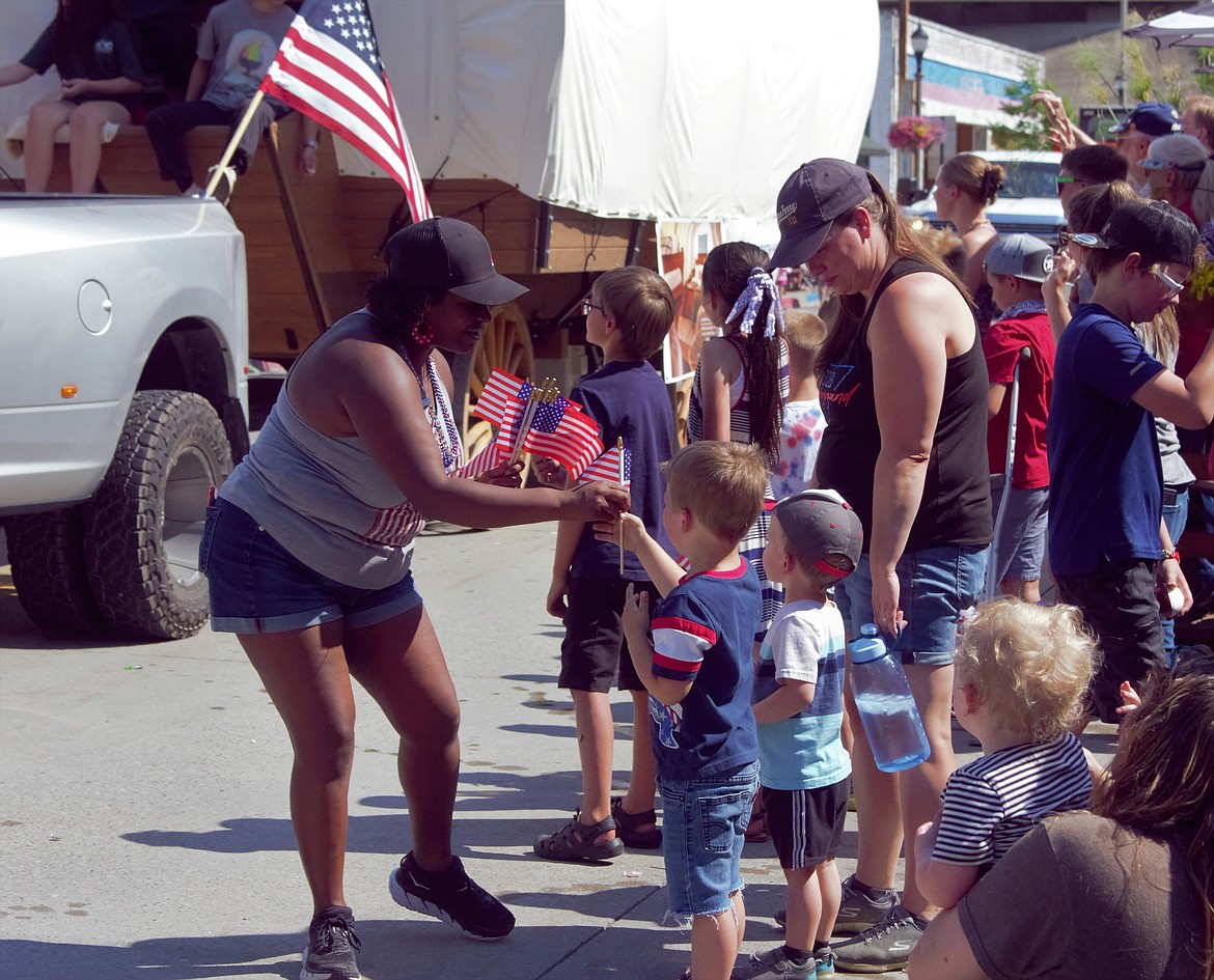 Young parade attendee receives an American flag at the Bonners Ferry Independence Day Parade