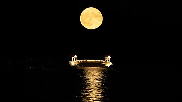 The first of several supermoons that will rise this summer is pictured here Monday evening over Coeur d'Alene. Monday's moon is a full buck moon, a name given to it because the antlers of deer are in full-growth mode in July. Supermoons are the result of the moon being closer to Earth at the time of a full moon, according to Space.com.