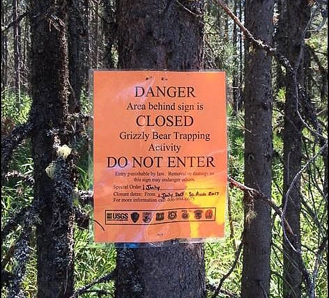 Signs mark Grizzly capturing areas to keep hikers and recreators safe.