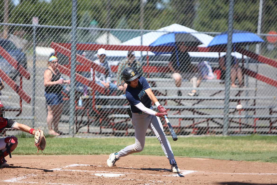 River Dog third baseman Cruz Martinez makes contact with a pitch at the Spokane Wood Bat Classic.