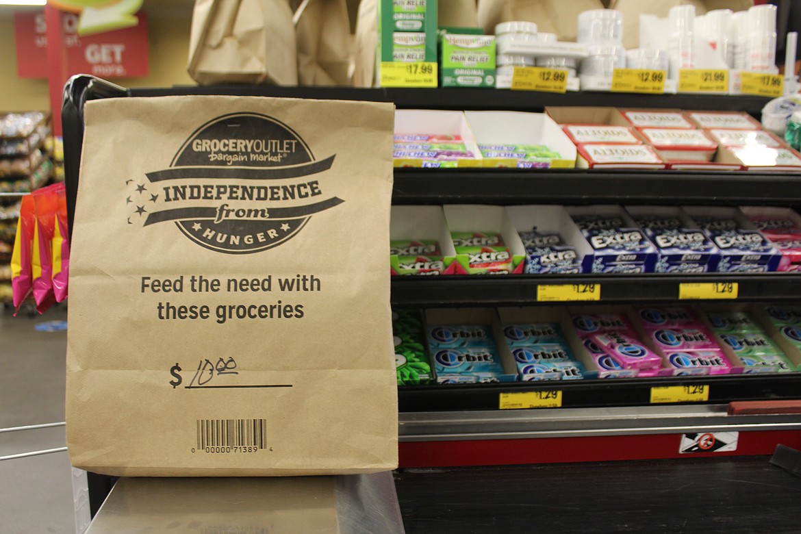 Bags for the “Independence from Hunger” campaign are available at the Moses Lake Grocery Outlet checkout counter.