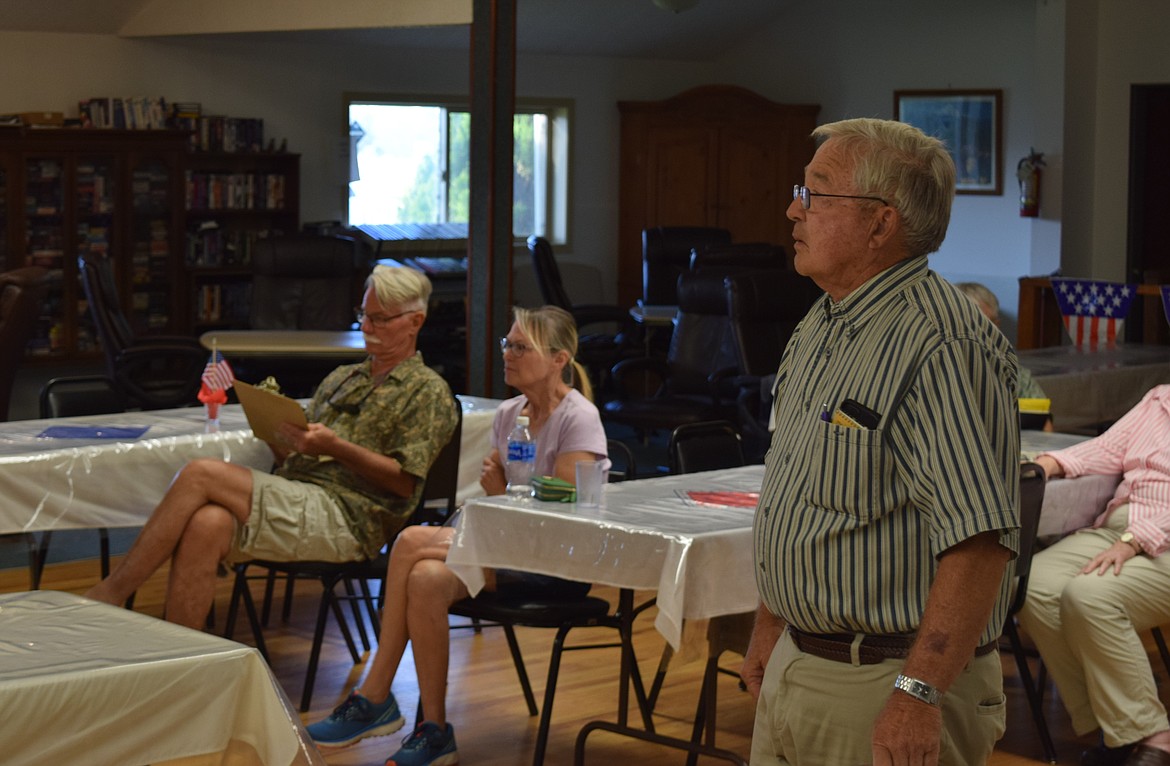 Steve Wellein, standing, watches the Soap Lake City Council as they officially approve his appointment to fill the vacant city council position until an official election for the position will be held.