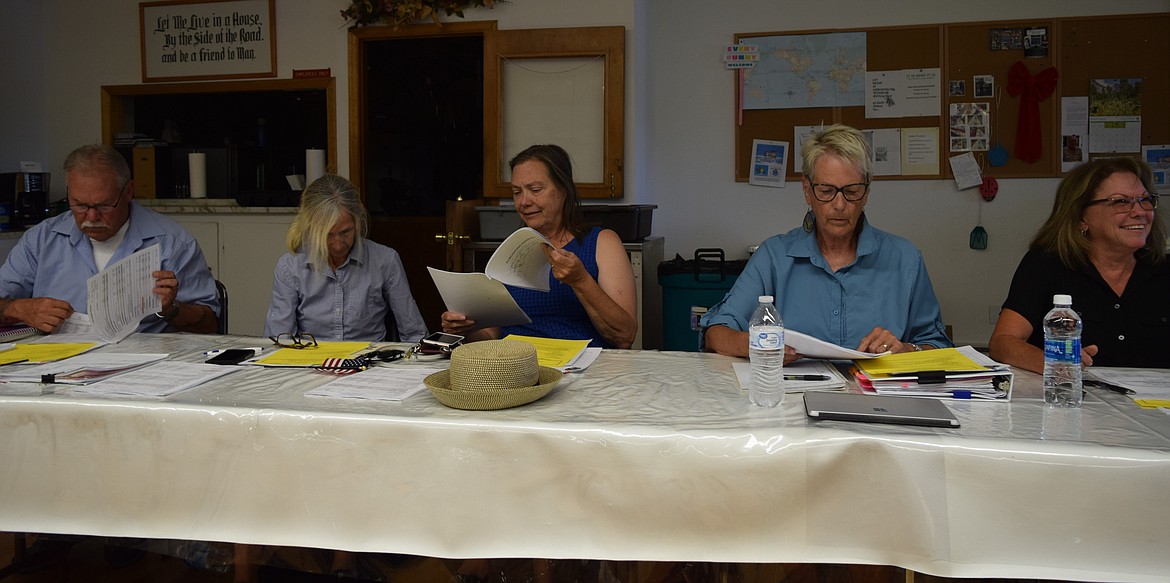 Council members Allen DuPuy, Karen Woodhouse, Leslie Taylor, Kayleen Bryson and JoAnn Rushton review Soap Lake’s updated purchasing manual during Wednesday’s regular meeting in the Soap Lake Community and Senior Center.