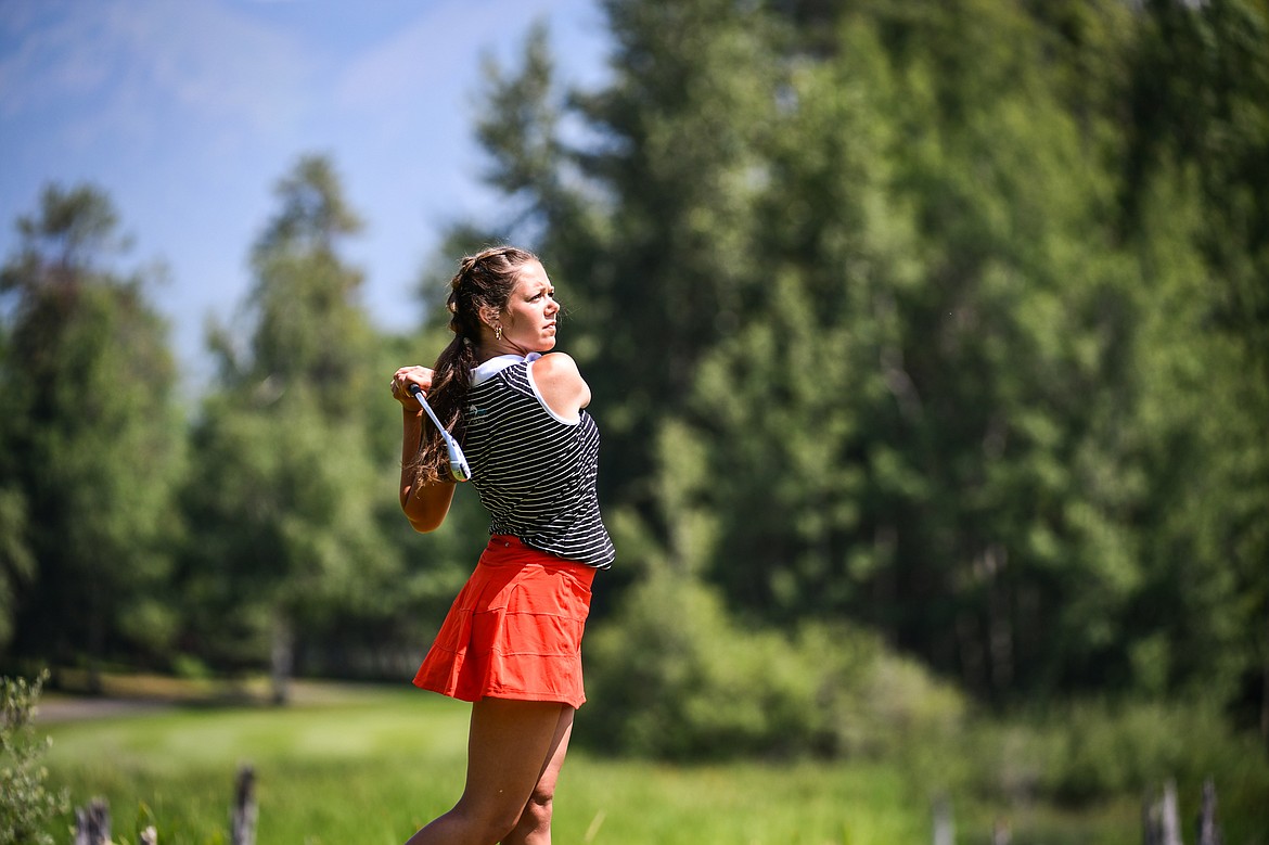 Chloe Tanner watches her tee shot on the 7th hole of the South Course during the Fourth of July Golf Tournament at Whitefish Lake Golf Club on Friday, July 7. (Casey Kreider/Daily Inter Lake)