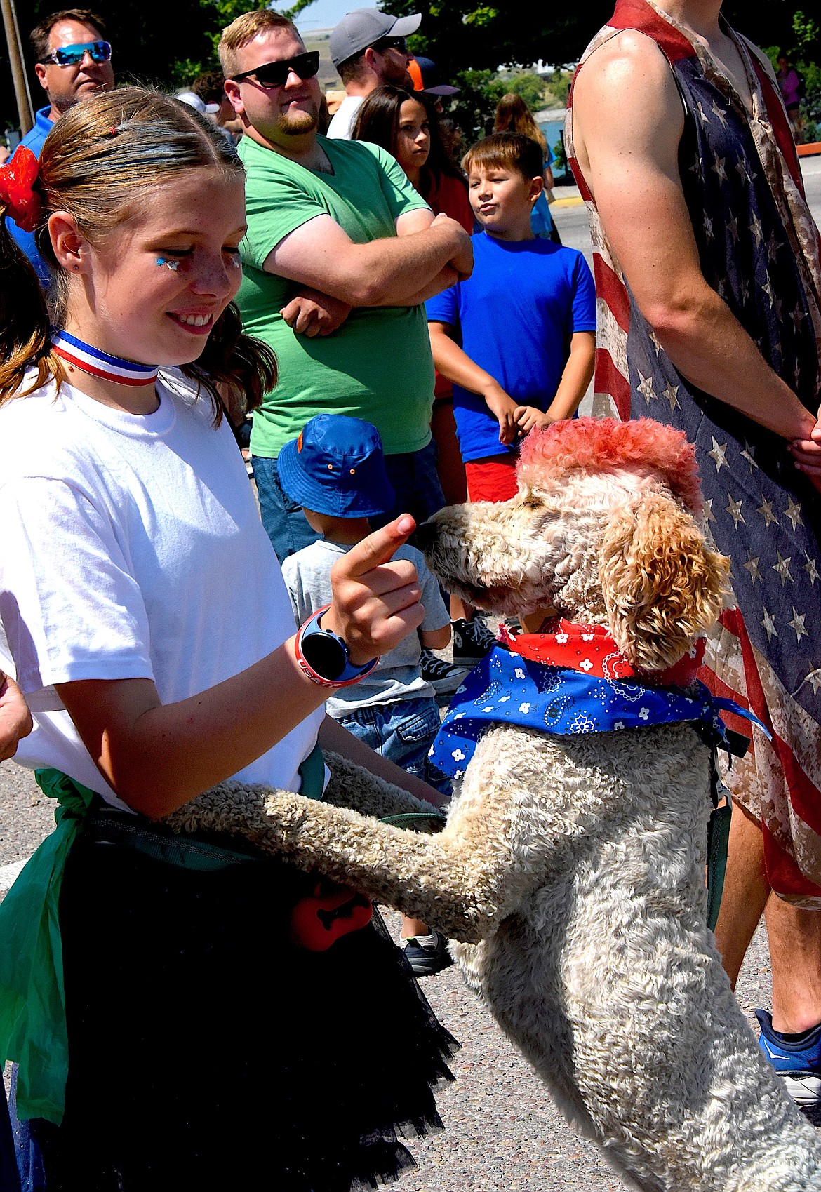 Morgan Delaney and her dog Phil celebrated the Fourth of July with traditional colors -- Phil's mohawk was red and his tail was blue, and Morgan's outfit was a combination of red, white, and blue. (Berl Tiskus/Leader)