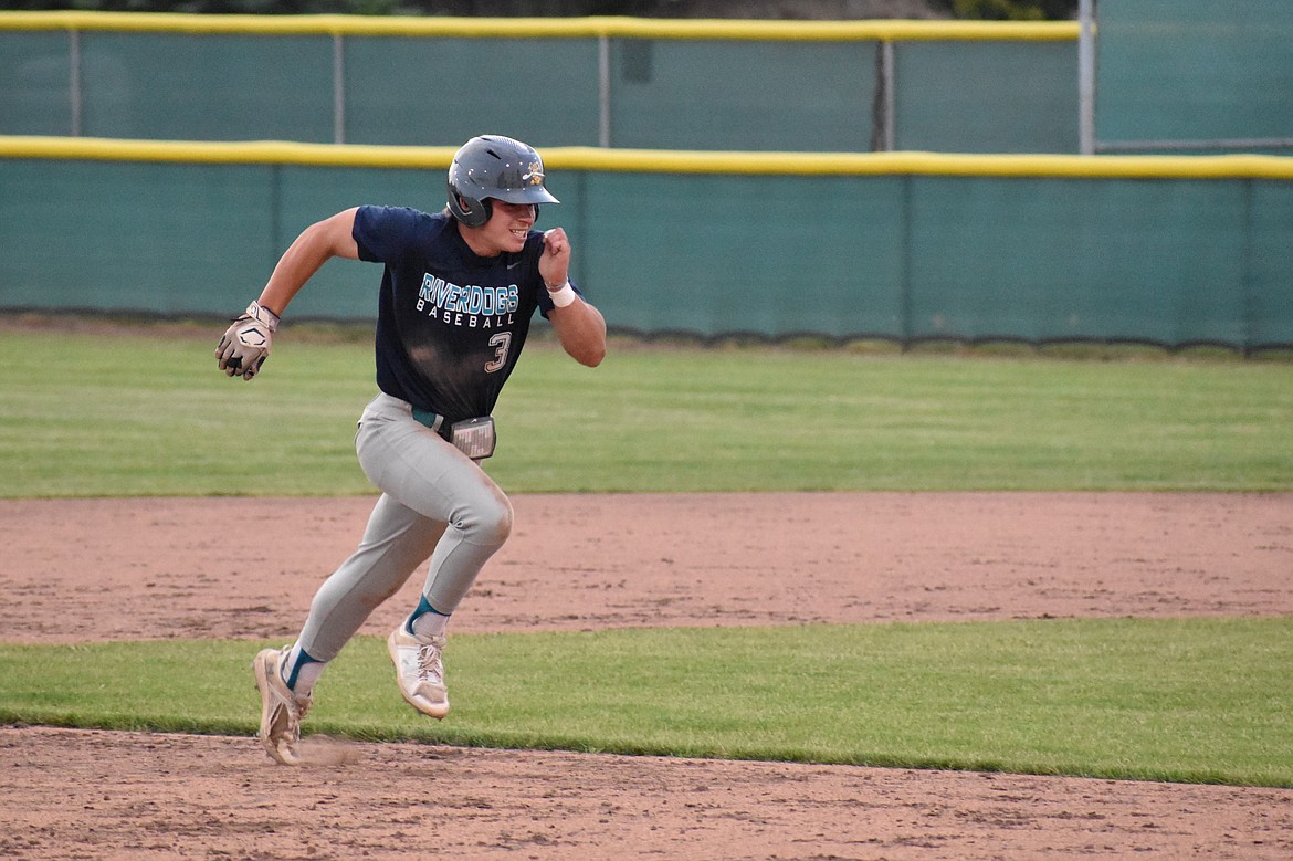 A 14U Moses Lake pitcher gets ready to pitch against the 14U Columbia Basin River Dogs on Thursday in Moses Lake.