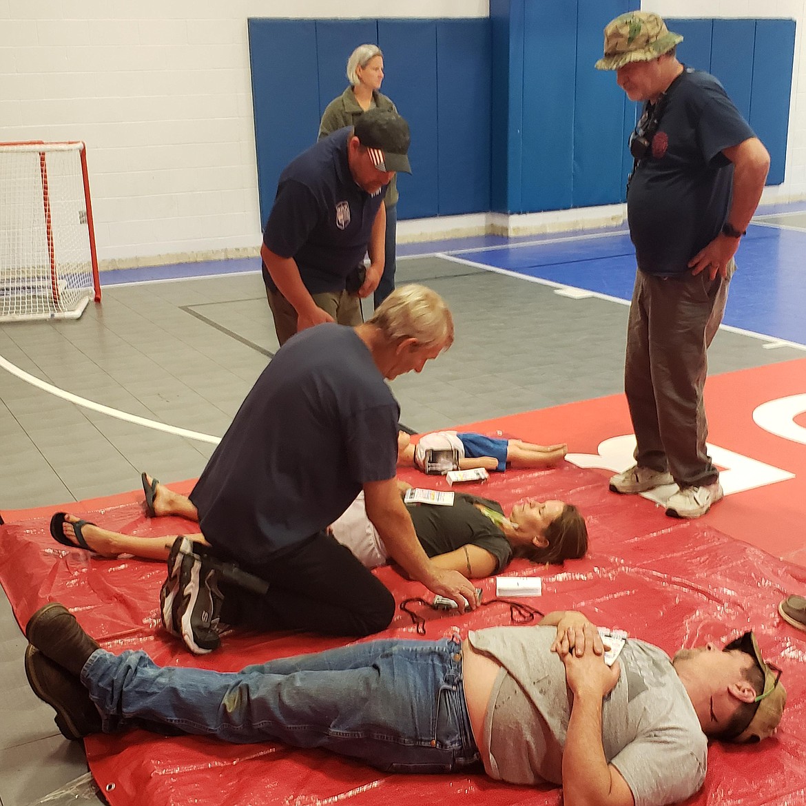 St. Regis Fire Chief Jerry Dockter, kneeling, participates in Mineral Community Hospital's class on tactical emergency care. (Photo Angela Visintin)