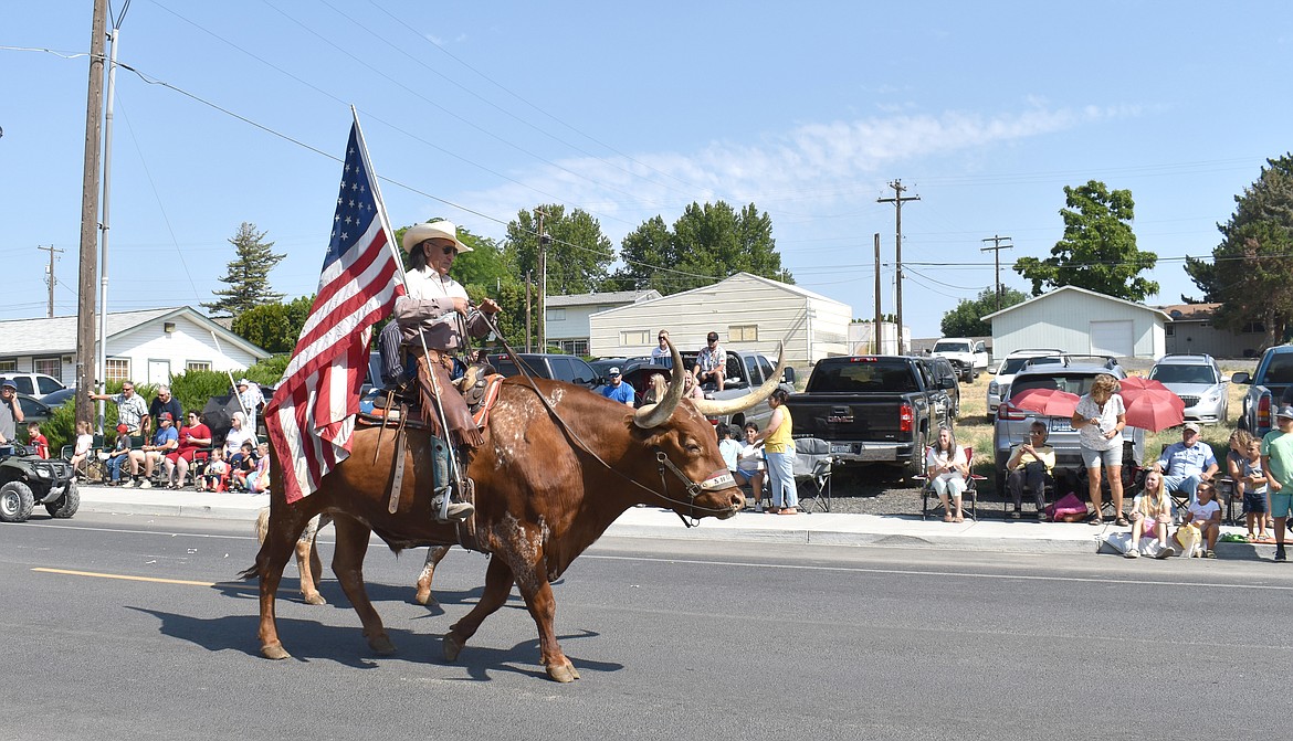 Gary Potter of Royal City rides his longhorn steed in the Summerfest parade Saturday morning.