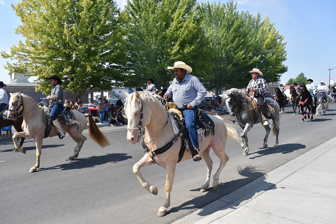 Royal City’s Dancing Horses caper down Camelia Street in the Summerfest parade Saturday morning.