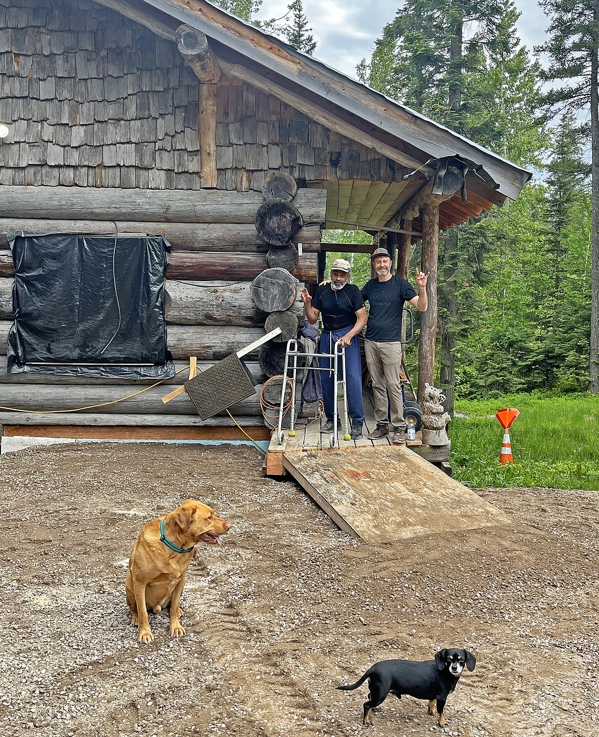 Gary Cabell and Jesse Miller at Cabell's cabin with new ramp and improved parking area. (Photo provided)