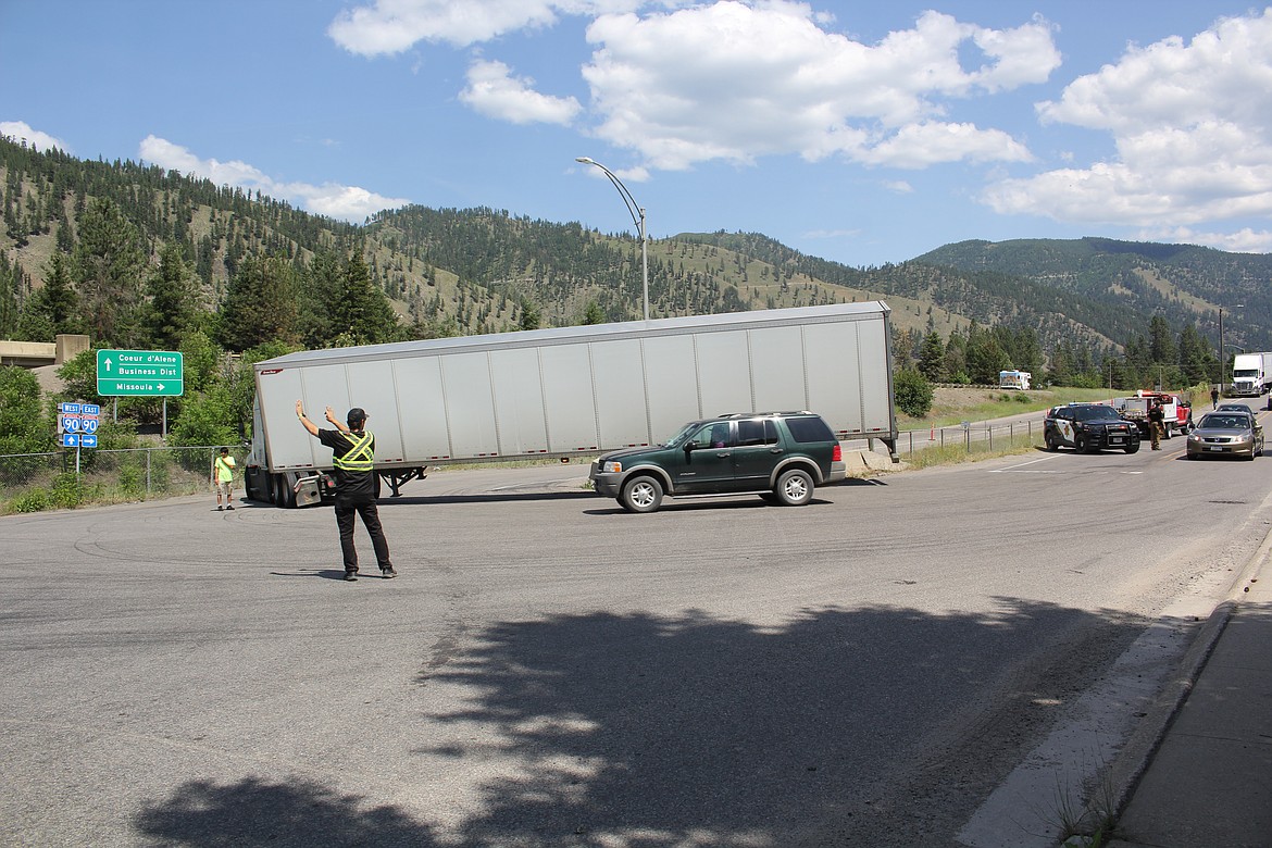 A semi gets stuck on the eastbound on-ramp of I-90 on Thursday after refueling at Town Pump. Traffic was snarled for about 90 minutes. “This happens more often than you’d imagine,” explained an employee with Superior Towing. (Monte Turner/Mineral Independent)