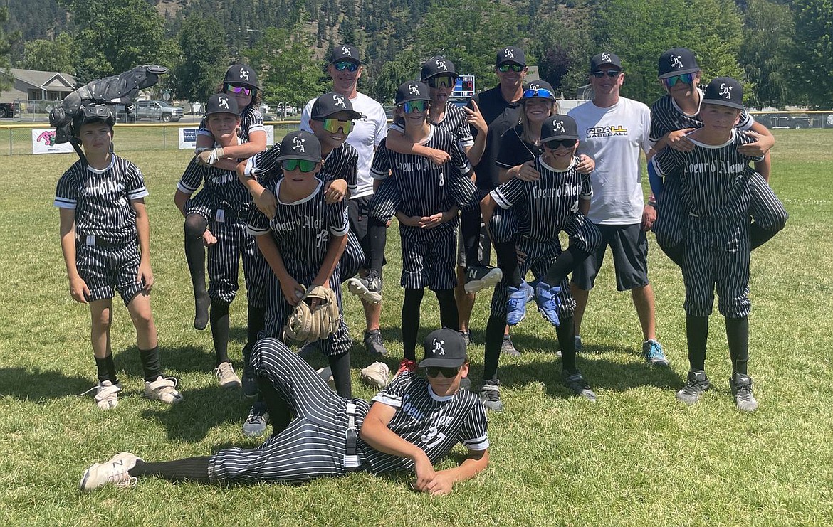 Courtesy photo
The Coeur d'Alene Little League 12U All-Star team went undefeated over two weekends of pool play to earn the No. 1 seed going into the District 1 best-of-3 championship series this weekend against Sandpoint. The winner advances to the best-of-3 state playoffs next weekend in Boise against the District 2 champion. Games this weekend, at Croffoot Park in Hayden, are Friday and Saturday, and Sunday in necessary. The Coeur d'Alene 12U All-Stars went 6-0 in pool play and outscored their opponents 85-0. Clay Larwin hit two home runs and Trent Lilyquist hit one for Coeur d'Alene in pool play. Bryce Petrella pitched a total of 12 innings, allowing five hits, walking two and striking out 30. The rest of the pitching staff — Caleb Brumbach, Nash Russell, Rixton Bateman and Cooper Fordham — combined for 13 innings and allowed three hits, walked seven and struck out 37. In front is Cooper Fordham; in the middle from left, Nash Russell, Rixton Bateman, Kovack Dolan, Bryce Petrella, Kyle Everson, Caleb Brumbach, JJ Larson, Jack Kreis, Blake Anderson, Clay Larwin and Trent Lilyquist; and back row from left, coach Jon Larson, manager Dave Everson and coach Jeff Kreis.