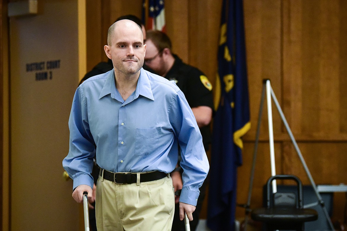 Jonathan Douglas Shaw walks to the defendant's table after a recess in his murder trial in Flathead County District Court in Kalispell on Tuesday, July 11. (Casey Kreider/Daily Inter Lake)