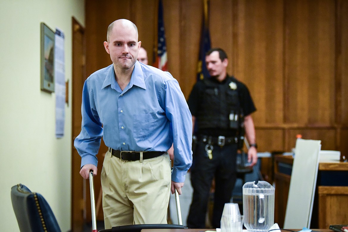 Jonathan Douglas Shaw walks to the defendant's table after a recess in his murder trial in Flathead County District Court in Kalispell on Tuesday, July 11. (Casey Kreider/Daily Inter Lake)