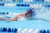 Swim team wins home meet by a wide margin