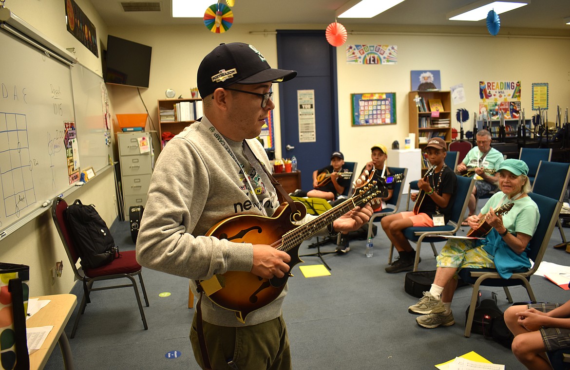 Shawn Hughes teaches players of mandolin and guitar some techniques for playing fiddle tunes at the Washington Old Time Fiddlers Fiddle Camp Tuesday. Hughes, who lives in the Tri-Cities, also plays with the Badger Mountain Dry Band, a Northwest bluegrass fixture for 35 years.