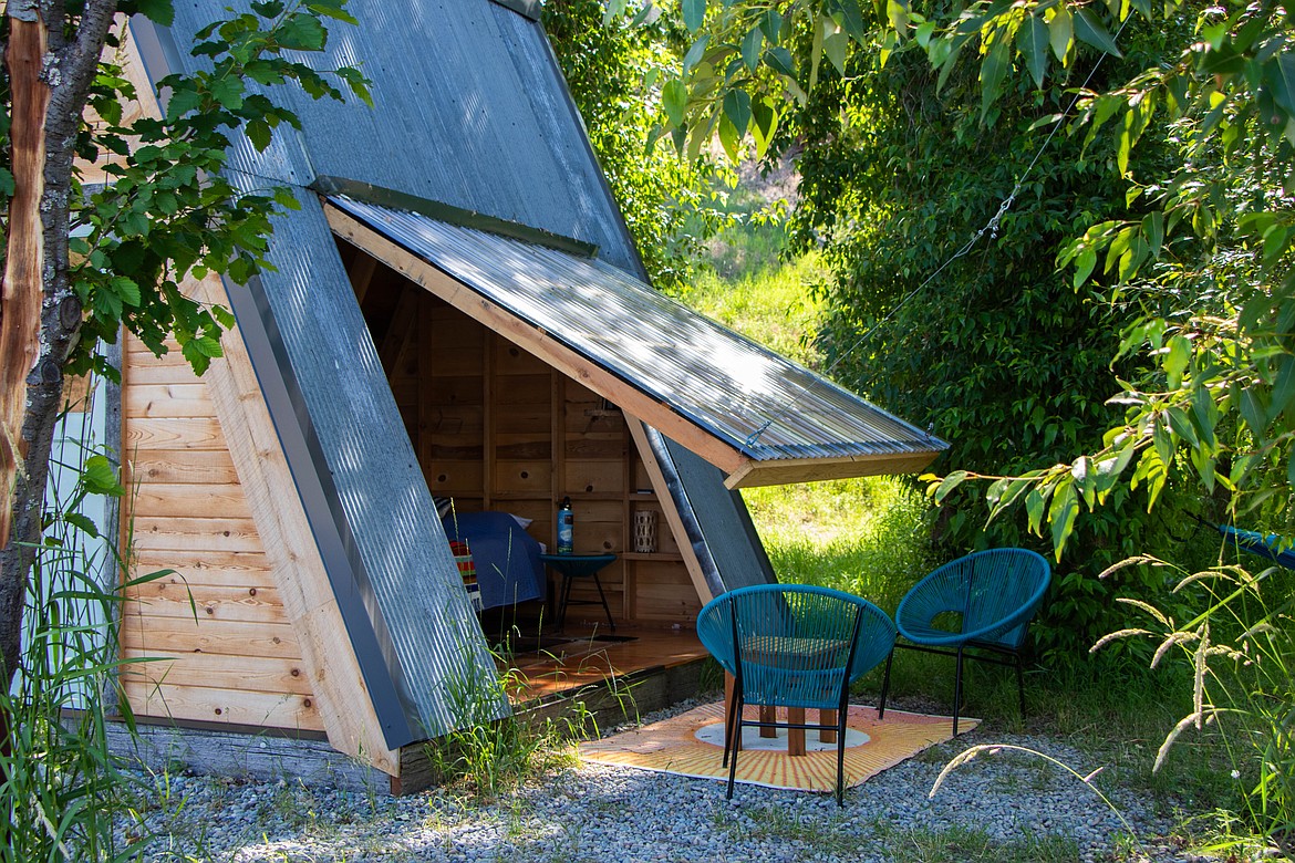 The A-Frame cabin at the Tobacco River Ranch glamping site has a plastic side panel that lifts up. (Kate Heston/Daily Inter Lake)