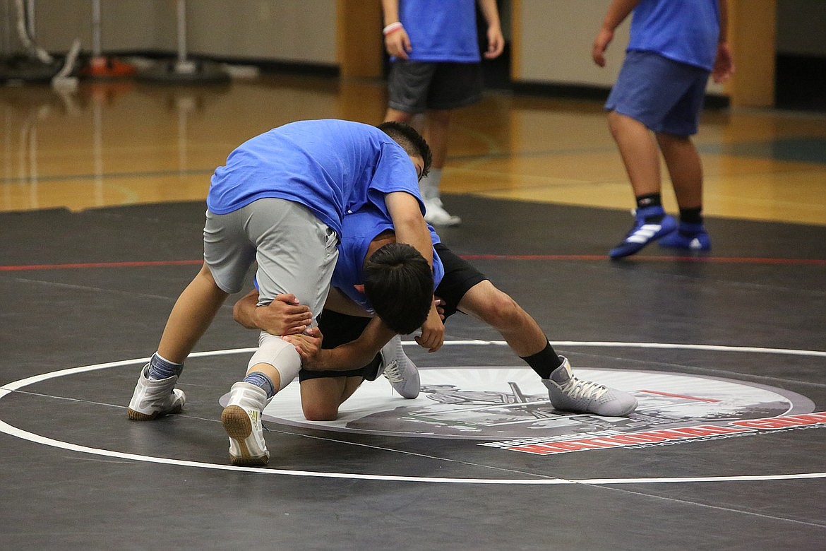 Campers compete against each other at the Warden wrestling summer camp last July. The camp features instruction by four-time state champion Chris Castillo.