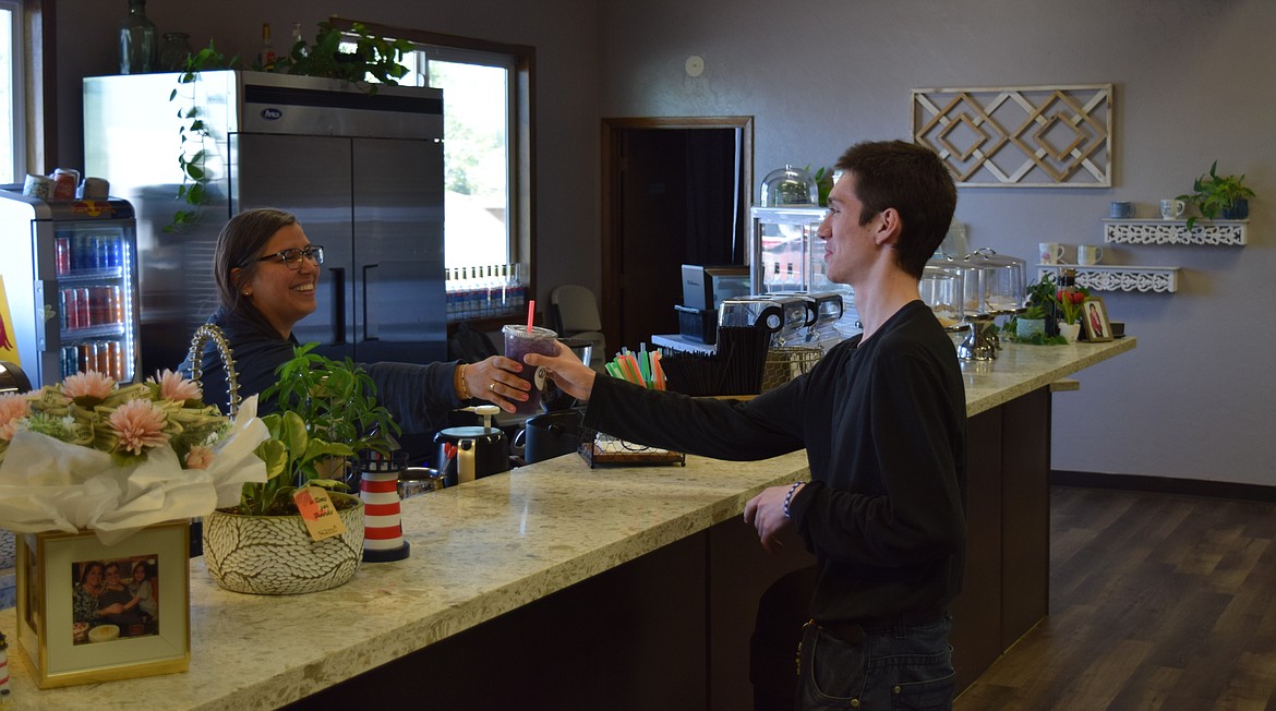 Samantha Garza serves a customer in Lighthouse Café’s main room, which sees many students from Othello High School across the street from the cafe.