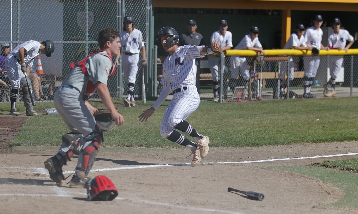 JASON ELLIOTT/Press
Northern Lakes runner Raiston Ellwood slides home safely during the first inning of Wednesday's North Idaho League game against Camas Prairie at Gorton Field in Rathdrum. Northern Lakes won the game 12-2 to clinch the second seed to the class A Area A tournament starting this weekend in Sandpoint.