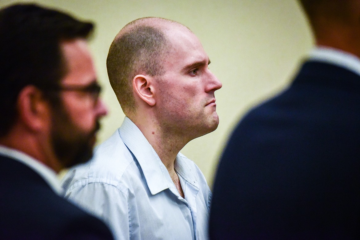 Jonathan Douglas Shaw stands with his defense team as his murder trial resumes in Flathead County District Court on Thursday, July 13. (Casey Kreider/Daily Inter Lake)