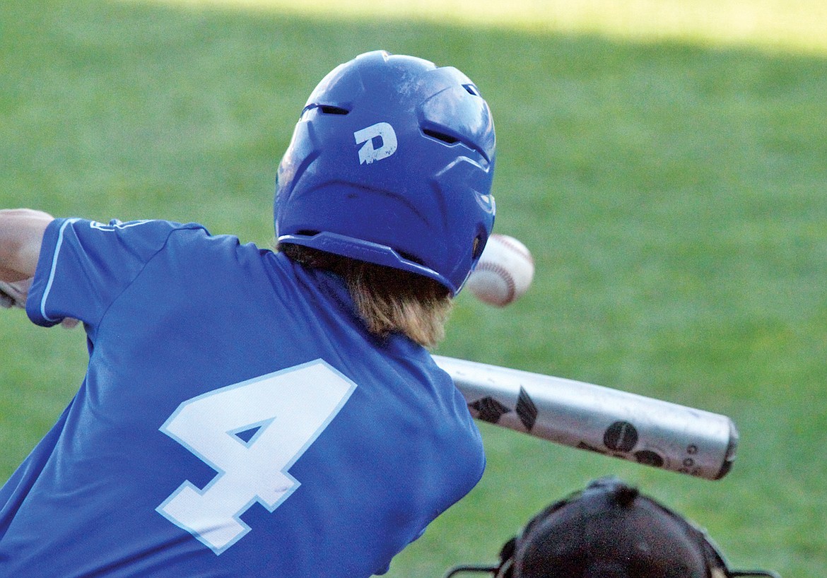 Libby Loggers player Dylan Buckner bunts safely on the 0-0 pitch in the bottom of the first inning with one out in the second game of a doubleheader Wednesday evening at Lee Gehring Field. (Paul Sievers/The Western News)