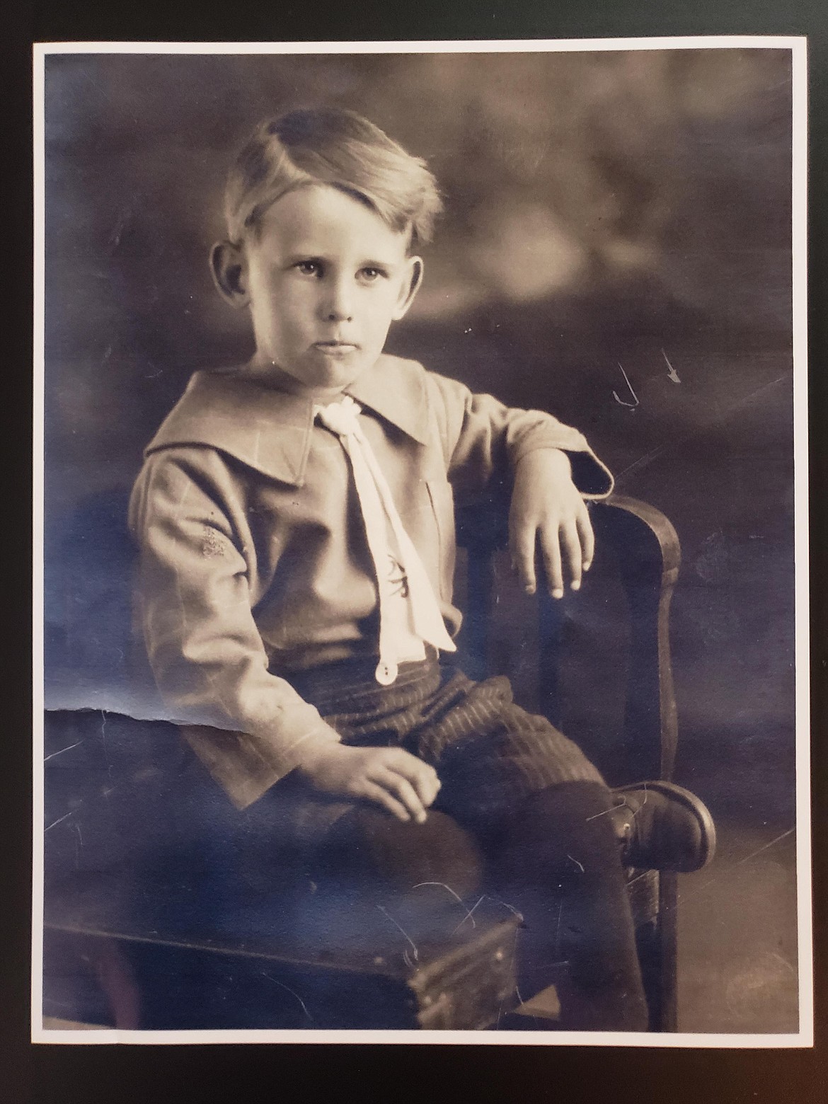 Barbara Bennett borrowed a family photo of Lovell Tucker, son of the Tucker Box Factory founder, to scan and enter to the city of Hayden's record of historical families Thursday.