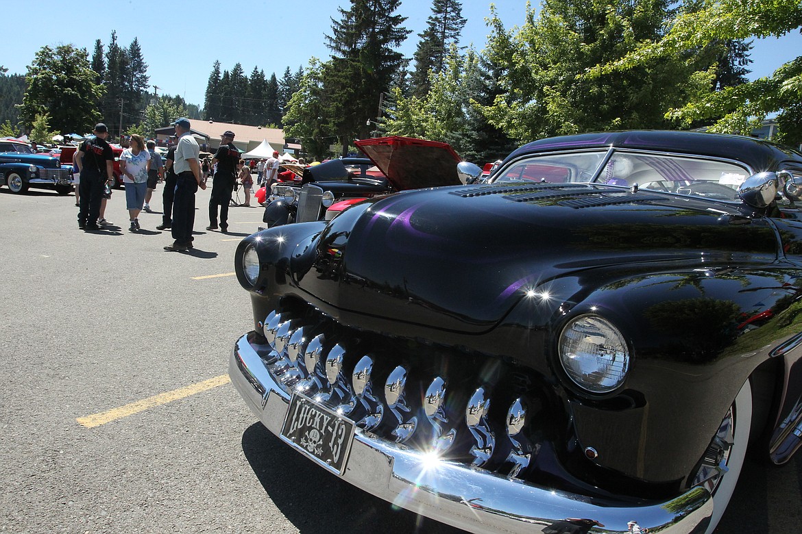 Jim Morse's custom purple 1950 Mercury Monterey, "Elvira," seems to flash a smile Saturday during the fourth annual Thunder in the Bay car extravaganza in Bayview. Morse, of Hayden, spent 10 years working on this beauty, which many people admired as they strolled through the show.