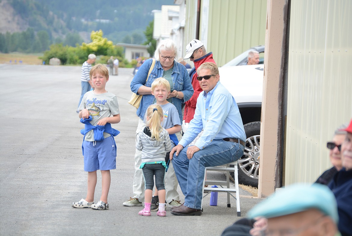 John and Mary Struzik, and Gabe, Zeke, and Avery Fullmer, all of Coeur d’Alene, wait for antique planes to arrive in Smelterville.

30 planes visited the Shoshone County airport Tuesday morning and were greeted by a crowd of locals during a stop on the Puget Sound Antique Airplane Club air tour.