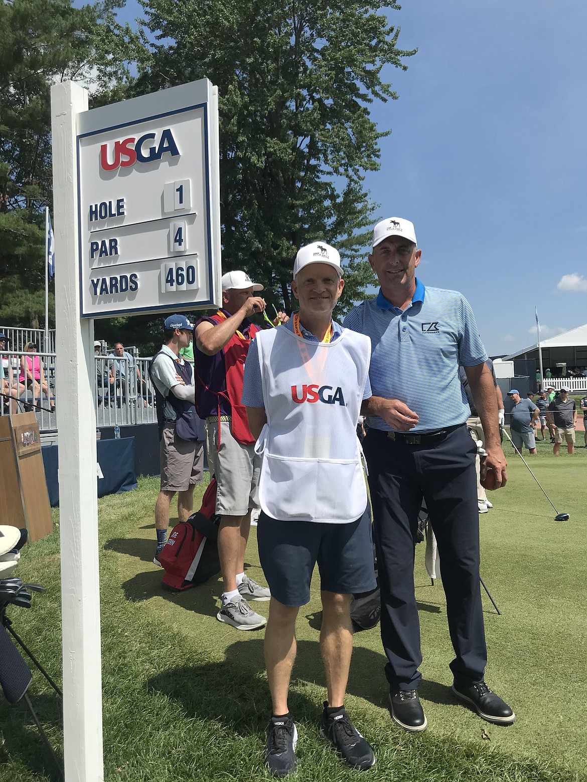 Jeff Gove poses for a photo at hole one with his caddy before playing a round at the U.S. Senior Open. In the second round, Gove shot a birdie on hole one.