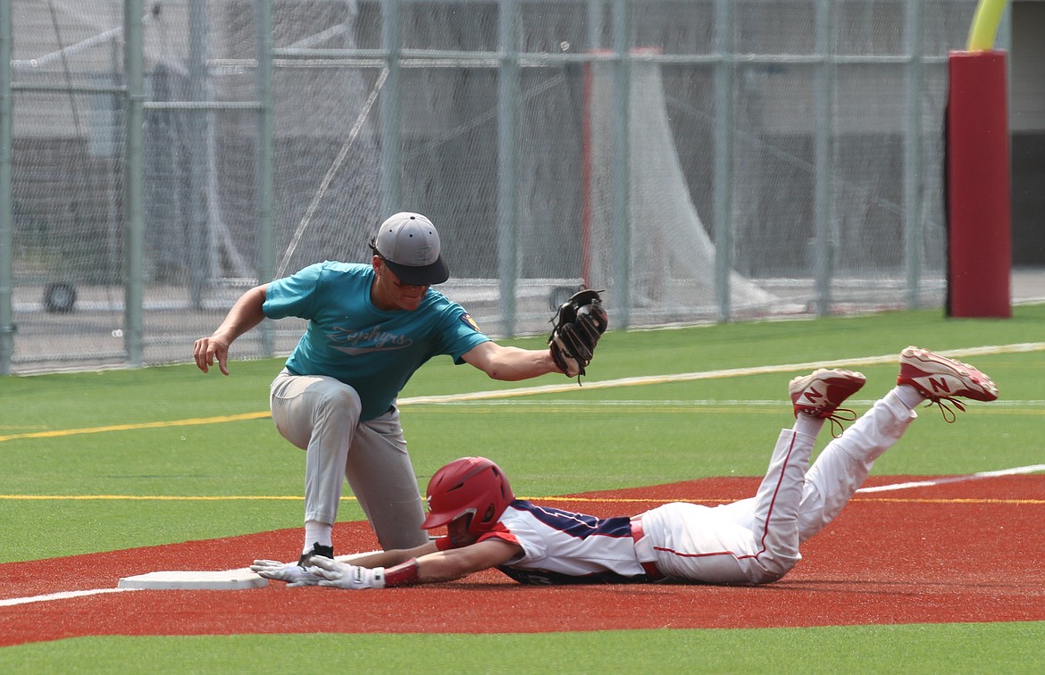 Coleman Inge successfully steals third base after avoiding Camas Prairie's James Aragon. Inge had three stolen bases in Friday's victory.