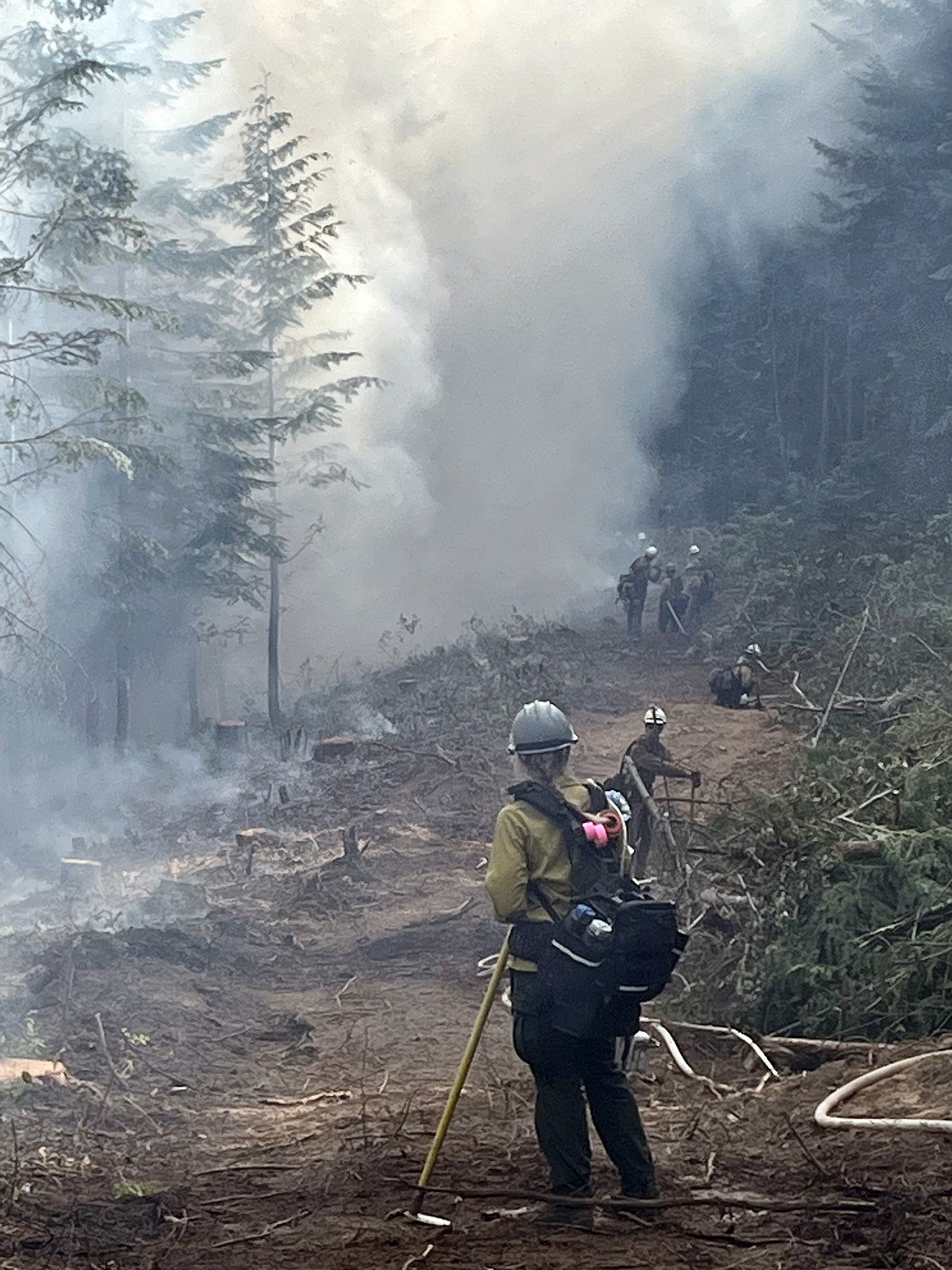 Firefighters work on a holding line on the Consalus Fire, located on the Priest River Ranger District in Pend Oreille County, Wash. The fire is 10 miles west of Coolin, Idaho.