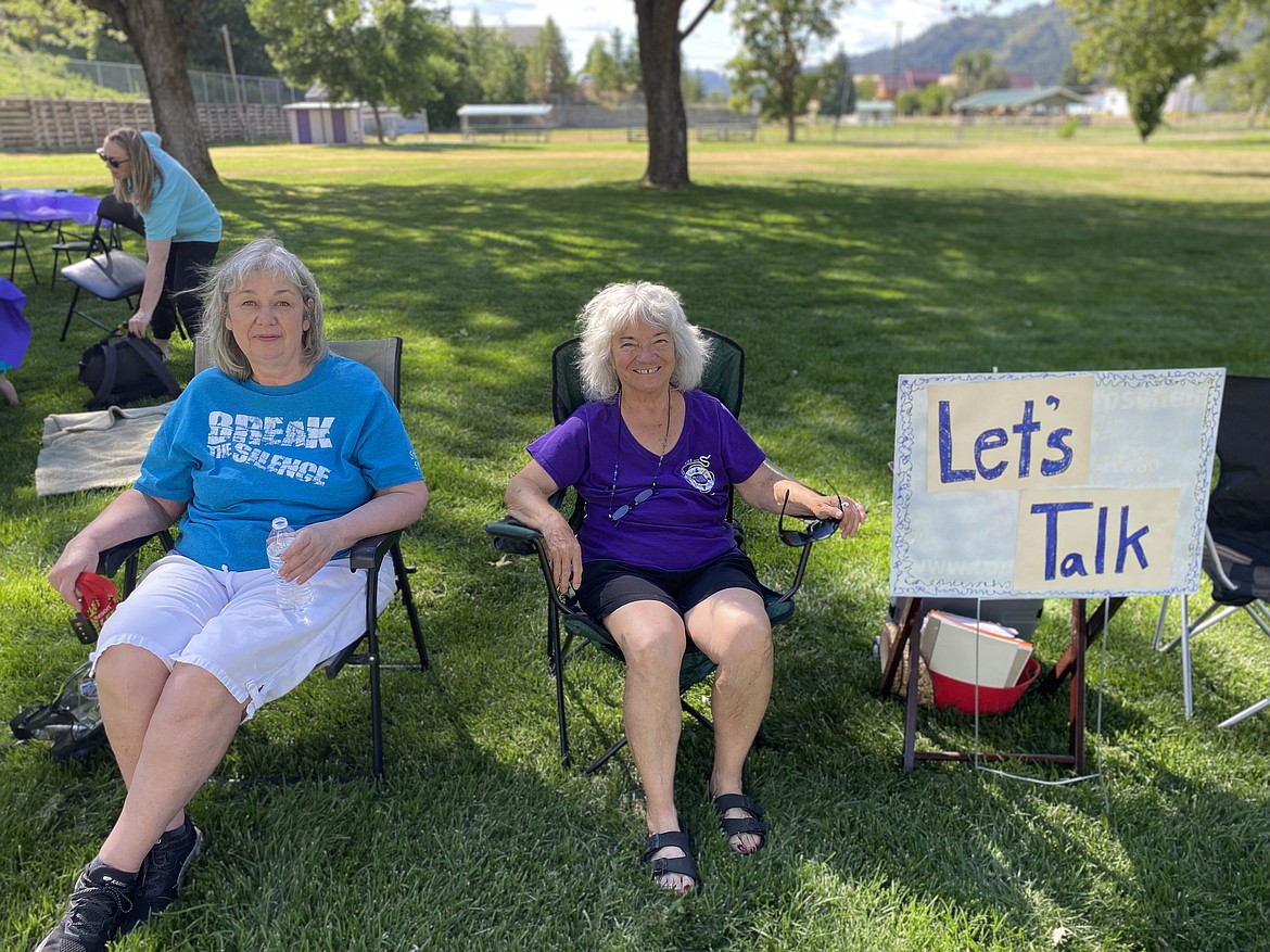 Mary Harding and Eve Heart could be found sitting in the shade Thursday by a sign that said “Let’s Talk.” The two are mental health professionals who made themselves available to help guide folks feeling overwhelmed after recent tragedies in the Silver Valley.