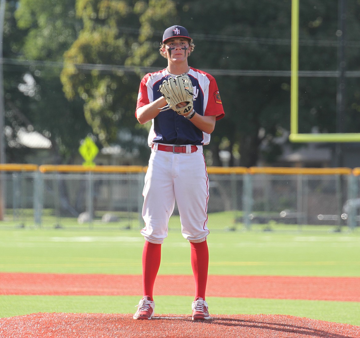 Dallen Williams contemplates what pitch to throw with catcher Jorden Tyler during a 3-2 count.