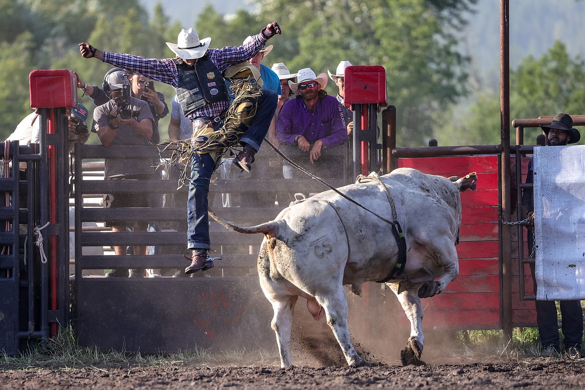 A bull rider is launched into the air at the Under the Big Sky rodeo on July 15. (JP Edge photo)