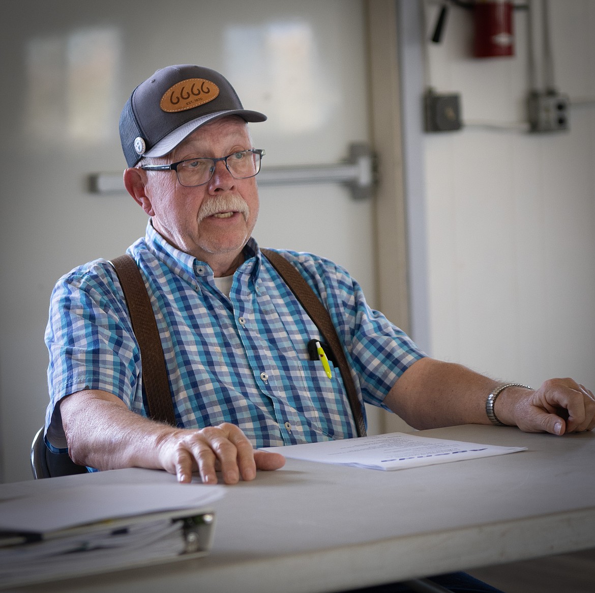 Jim Newman discusses long-term use of horse barns at the Sanders County Fairgrounds. (Tracy Scott/Valley Press)