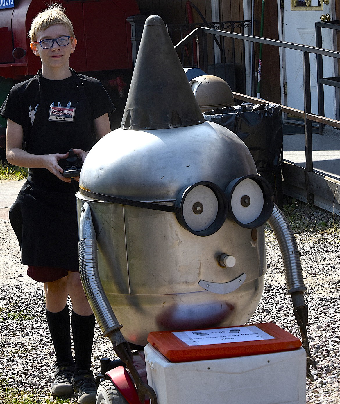 Evan Cashler pilots a robot around the Miracle of America Museum during Live History days. The robot's cooler is full of water for folks to buy.
(Berl Tiskus/Leader)