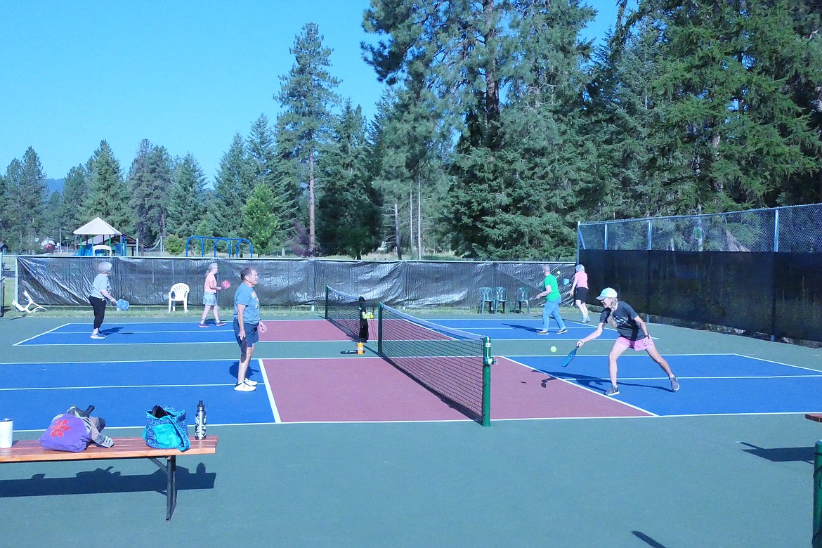 Players take to the four new pickleball courts that recently opened adjacent to Thompson Falls High School.  (Chuck Bandel/VP-MI)