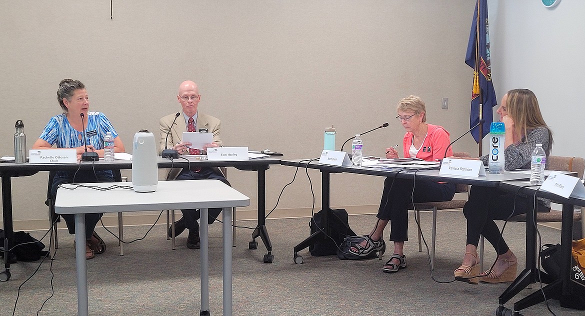Community Library Network Board Chair Rachelle Ottosen, left, speaks during Tuesday's special budget meeting at the Post Falls Library. Also pictured, from left: Vice Chair Tom Hanley and Trustees Katie Blank and Vanessa Robinson.